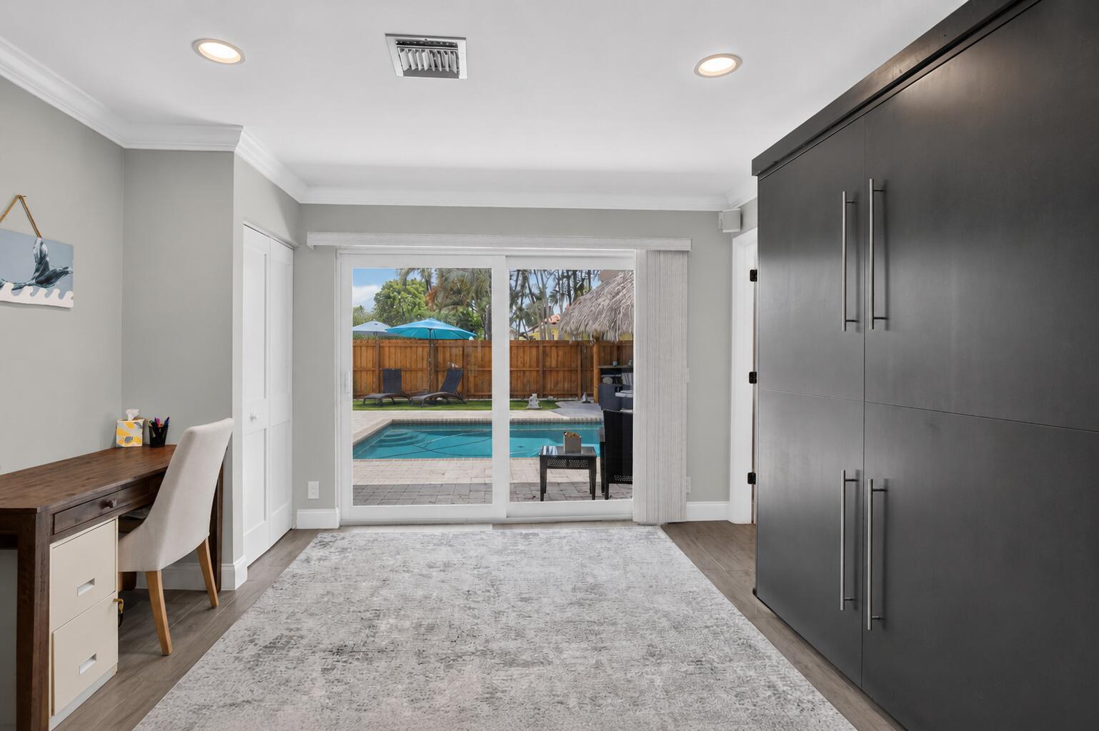 Flexible bedroom or office with pool access at 631 SW 17th Street