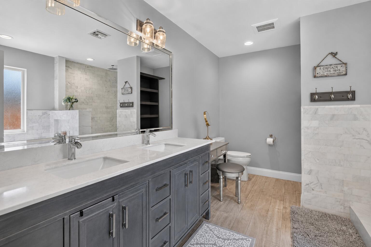 Primary bathroom with dual vanity at 631 SW 17th Street