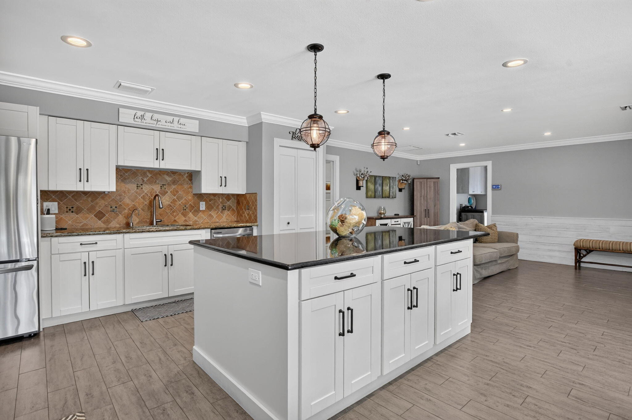 Kitchen with white cabinetry and granite counters at 631 SW 17th Street