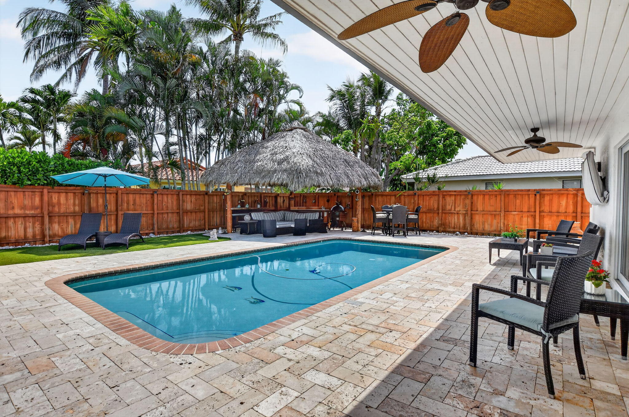 Heated saltwater pool and tiki hut at 631 SW 17th Street