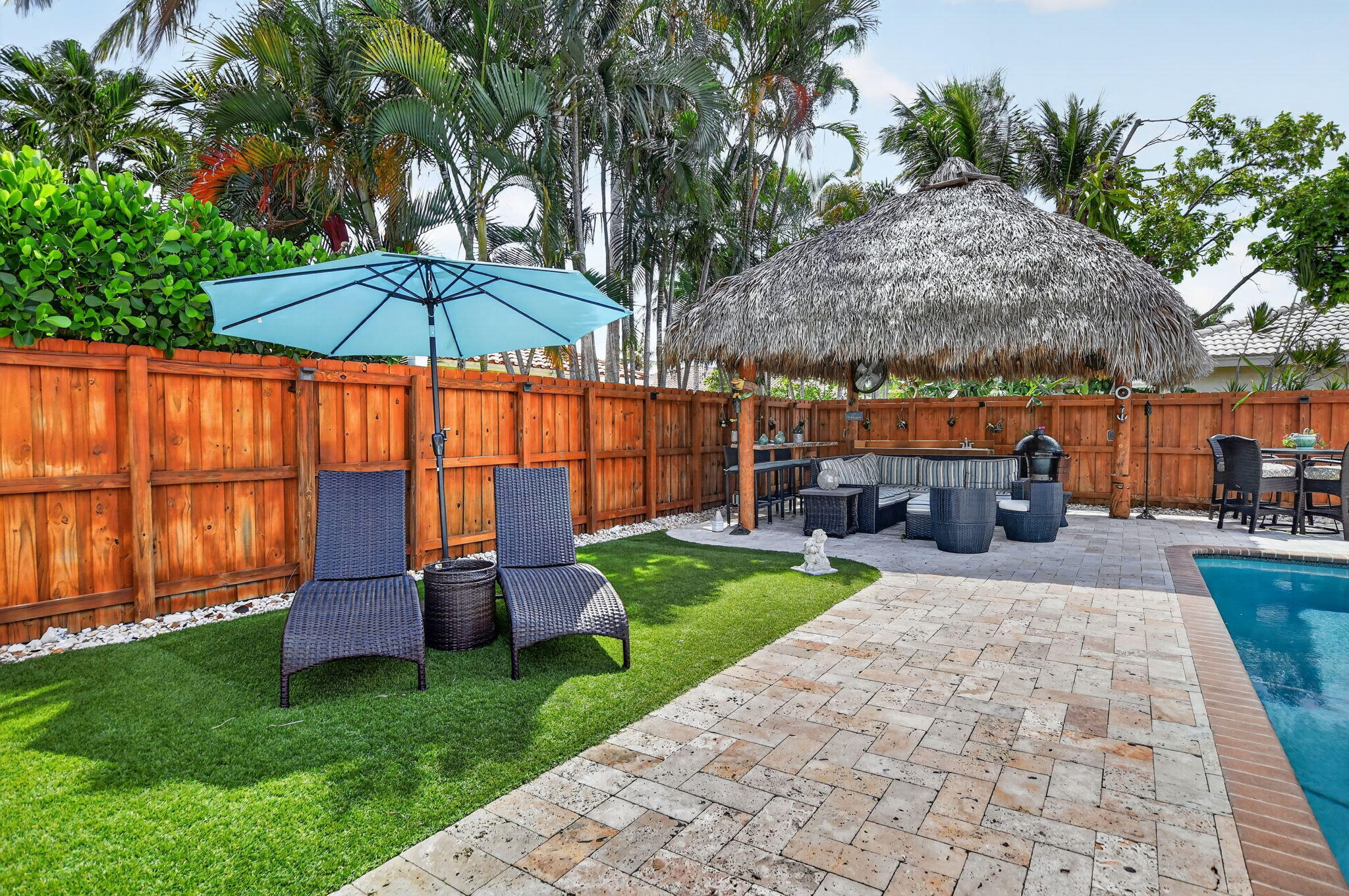 Travertine patio and tiki hut at 631 SW 17th Street