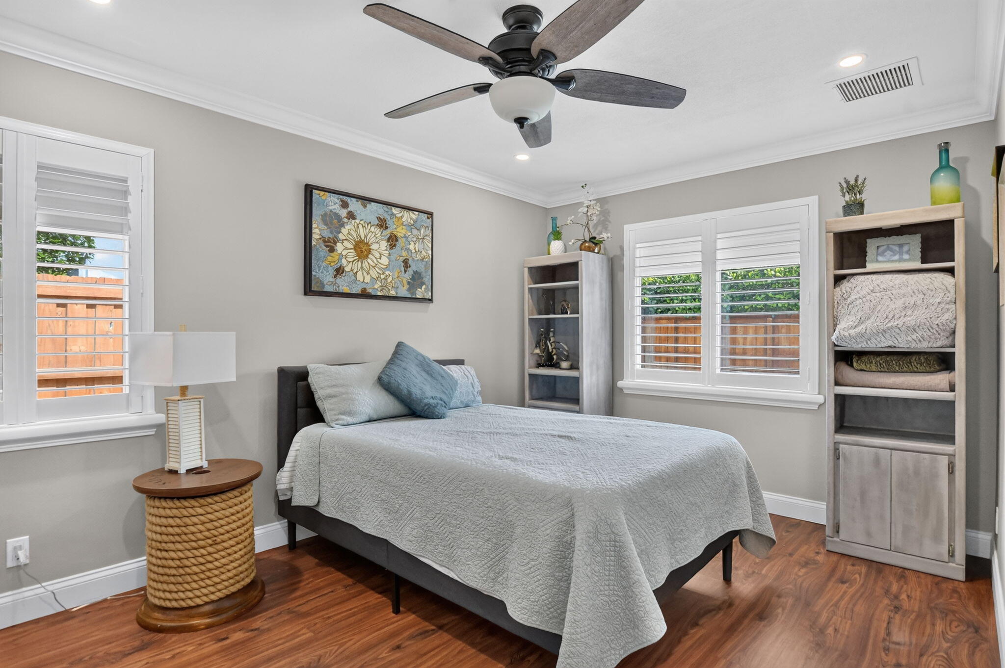 Guest bedroom with built-in shelving at 631 SW 17th Street