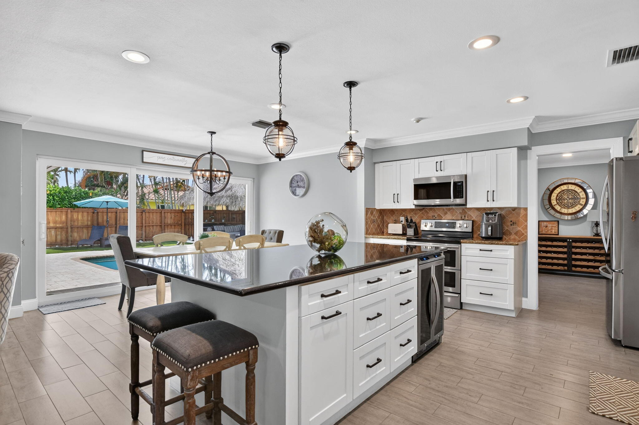 Updated kitchen with oversized island at 631 SW 17th Street